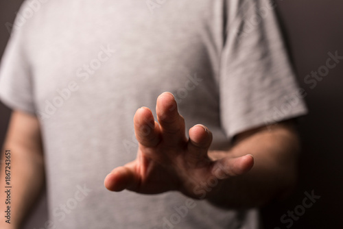 Close up of a hand reaching...