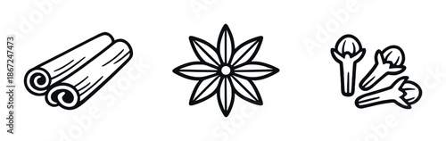 Cinnamon sticks, star anise, and cloves on black background