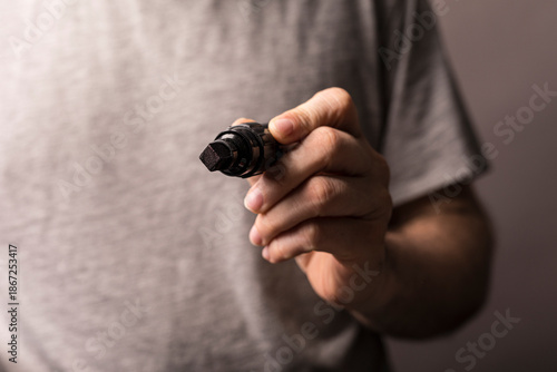 Close up of a hand gripping...