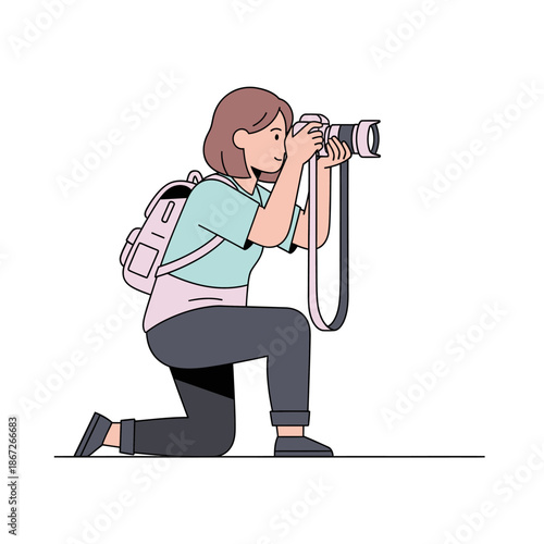 Woman photographer kneeling with camera and backpack, capturing a moment