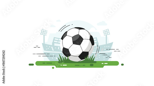 Classic black and white soccer ball positioned on a green grassy field in front of a stadium, ready for a game.