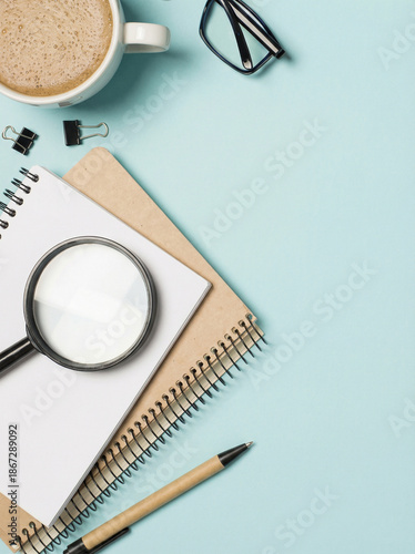 Wallpaper Mural Top view photo of workplace planners pen binder clips magnifier glasses and cup of frothy coffee on isolated light blue background with copyspace Torontodigital.ca