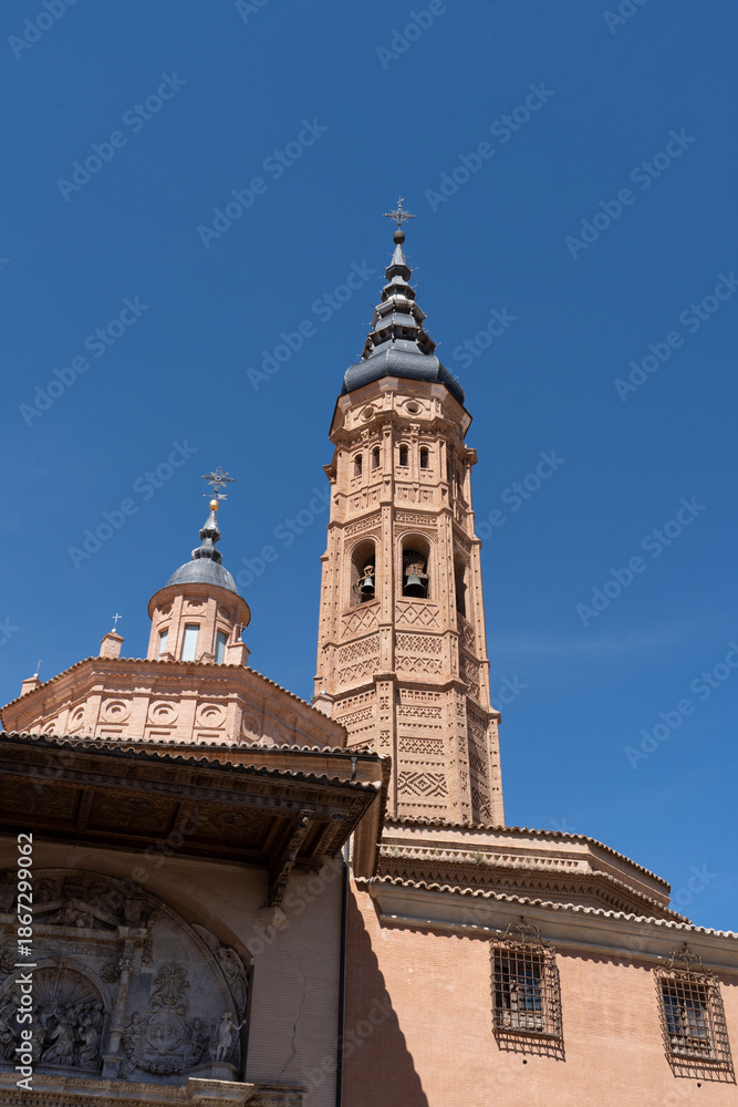 Fototapeta premium Tall church tower against a clear blue sky.. Collegiate Church of Santa María la Mayor, in Calatayud, Spain
