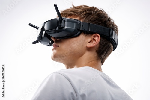 Immersive Drone Pilot Wearing FPV Control Goggles.
Rear view of a person wearing FPV drone goggles with antennas, highlighting immersive flight control, real time vision, and modern aerial technology.