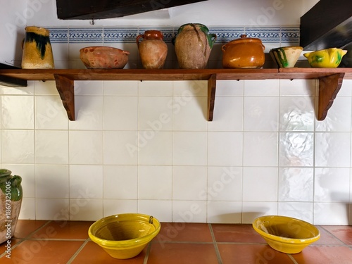 rustic kitchen setup with handmade ceramics, cozy cottagecore kitchen with terracotta and glazed