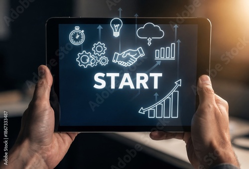 Close-up of Hand Touching Tablet Screen with Start Button and Icons