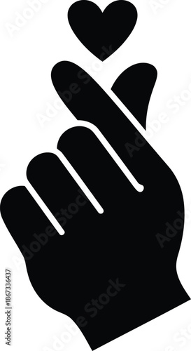 Black hand forming heart gesture with thumb and index finger