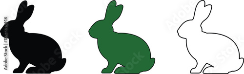 Three rabbits in black green and white sitting on ground