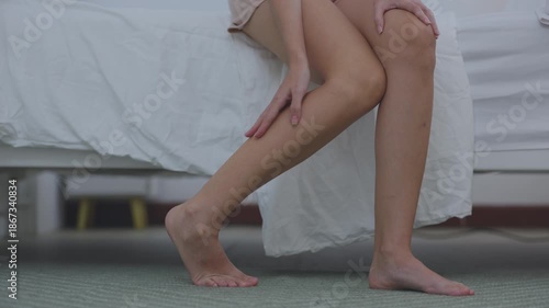 Woman Massaging Her Calf Due to Muscle Pain