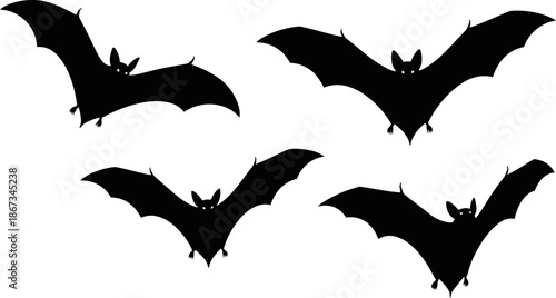 Four Silhouettes of Flying Bats Against a White Background Spooky Halloween and Night Animal Graphic