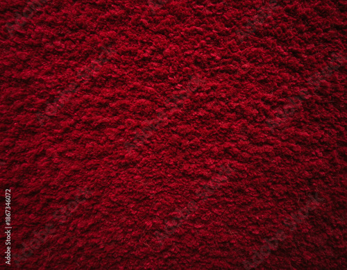 Seamless red textured fabric background, soft fuzzy surface, festive matte pattern for holiday design, product mockups, textile or digital backdrop