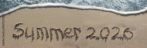 Word summer 2026 handwritten on the sand beach