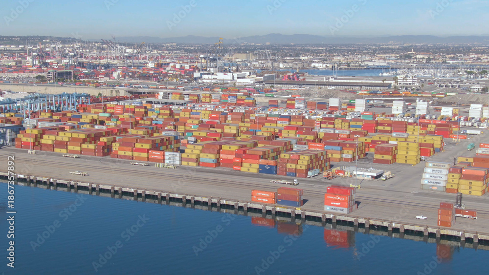 Fototapeta premium AERIAL: Flying along the colorful Port of Los Angeles on a sunny spring day.