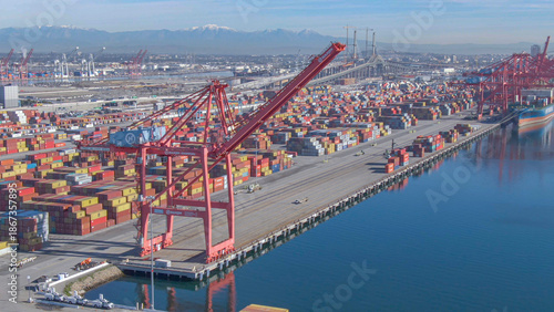 Bild auf Leinwand DRONE: Massive red cranes of the Port of Los Angeles tower over the ocean