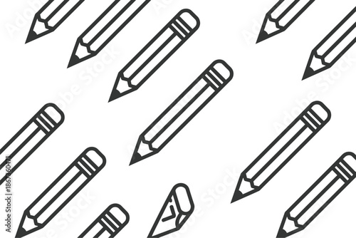 Scattered black and white pencils with sharpened tips