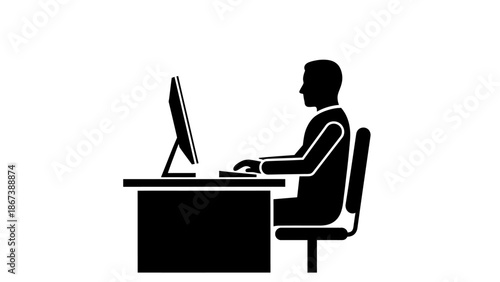 Focused Person Working at Desk with Desktop Computer, Black and White Silhouette