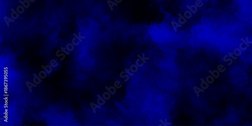 Abstract blue dust explosion on black background, blue smoke swirls dark  blue grunge watercolor grainy texture background, deep navy blue wallpaper for atmospheric and moody digital art designs.
