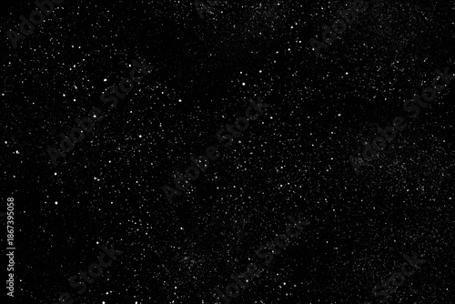 Chaotic white star bokeh on a isolated black background. falling blurry bokeh snow overlay, starry sky. white spots on black background, white drops and spots. abstraction.