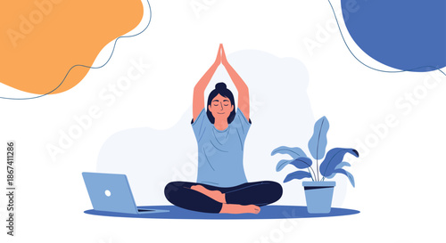 Peaceful woman practices yoga in a seated lotus position with her hands raised above her head near a laptop and a potted plant at home.
