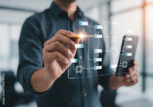 Businessman interacting with a futuristic digital flowchart on a transparent screen, symbolizing data analysis and business strategy