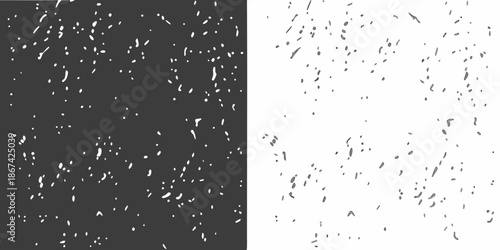 A stark contrast of black and white with scattered speckles throughout