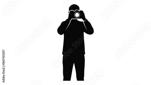 Silhouette of a photographer taking a picture with a camera