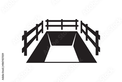 Open grave with wooden fence silhouette - Excavation pit surrounded by safety barrier