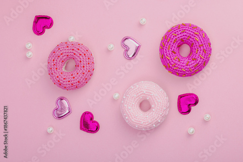 Handmade crocheted donuts with shiny hearts. Festive Valentines or Mothers Day, greeting card