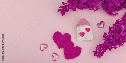 Handmade Valentines Day concept. Creative house figurines, traditional hearts, spring crocheting