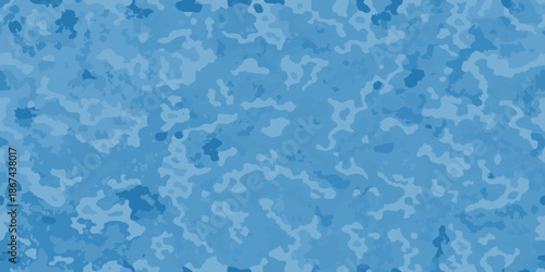 Abstract blue camouflage pattern with irregular shapes and varying shades