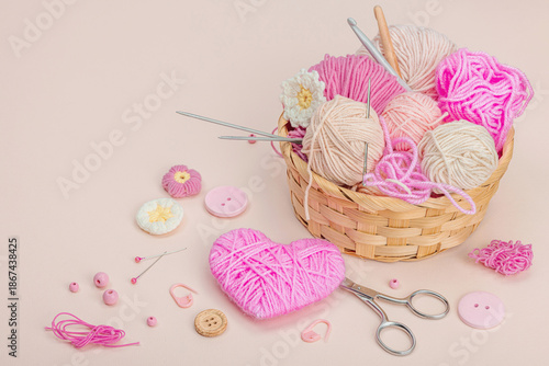 Handmade spring decor concept. Creative crocheting, house figurine, traditional flowers and hearts