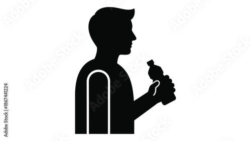 Silhouette of a man in profile holding a beverage bottle