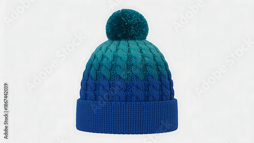 Vibrant blue and teal knit beanie with pom pom on white background