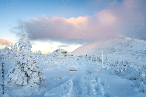 winter sunset in karkonosze mountains under Sniezka summit in Poland and Czech Republic 