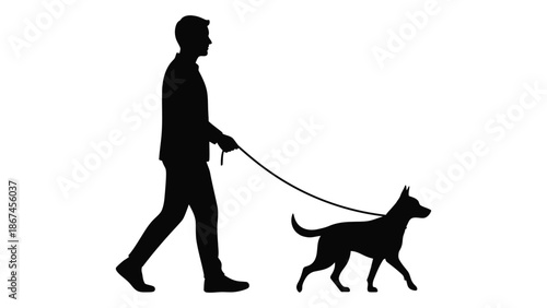 A silhouette of a man walking his dog on a leash outdoors