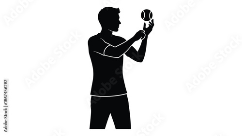 Silhouette of a man juggling a basketball showcasing athletic skill