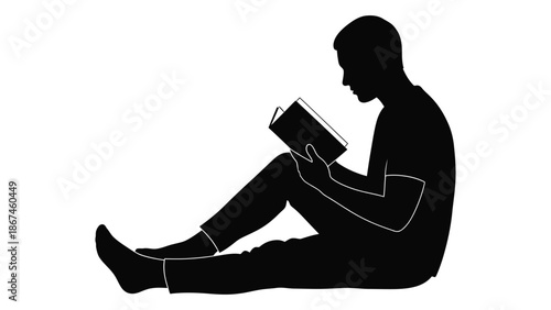 Silhouetted figure of a person deeply engrossed in reading a book