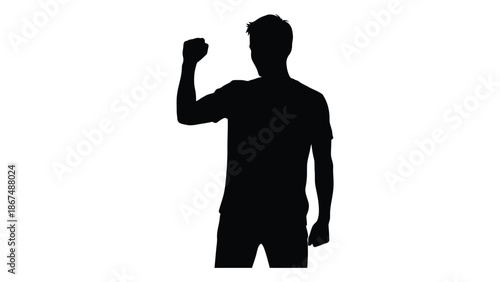 Silhouette of a man with raised fist expressing power and determination