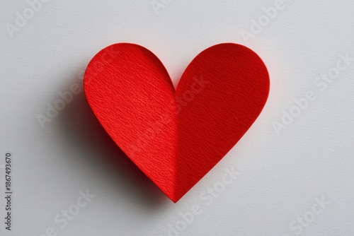 Vibrant Red Heart on Textured Paper Background