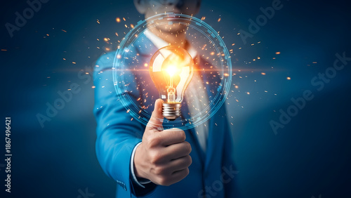Businessman showing thumbs up gesture with glowing light bulb symbolizing idea and innovation