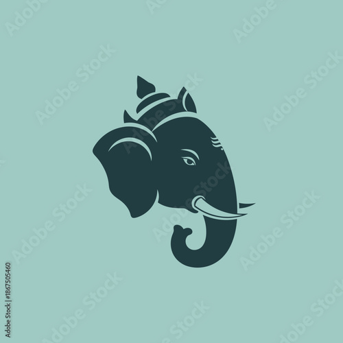 Stylized elephant head with ornate headdress and tusks.