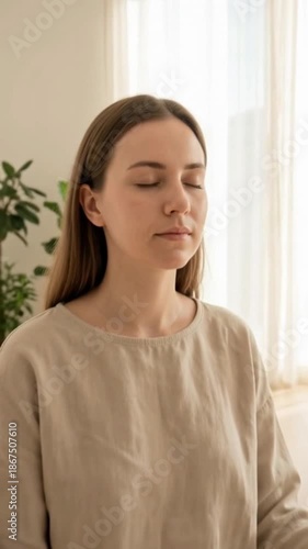 Peaceful Indoor Meditation Practice in Sunlit Minimalist Home with Plants