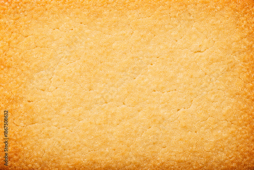 バタークッキーの焼き面が広がるマクロ質感背景