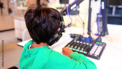 Kids engaging in science and technology workshops, learning about sound recording and broadcasting, using headphones and mixing equipment in an educational museum setting