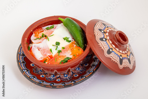 Wallpaper Mural Traditional Bulgarian Sirene po Shopski, a delicious baked egg and cheese dish with tomatoes and peppers, served in an authentic decorated clay pot, gyuveche.  Torontodigital.ca