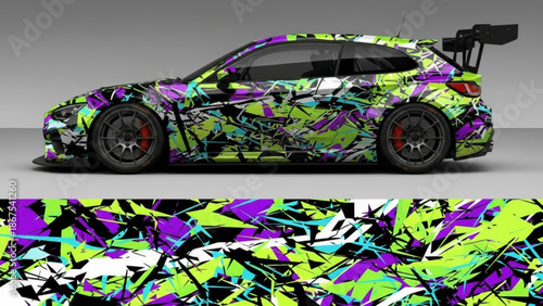 Sporty car with a vibrant abstract geometric graffiti style vehicle wrap design in lime green, purple, and black colors.