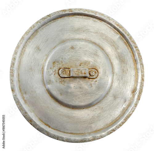 Old worn metal frying pan lid on a white background. Top view.