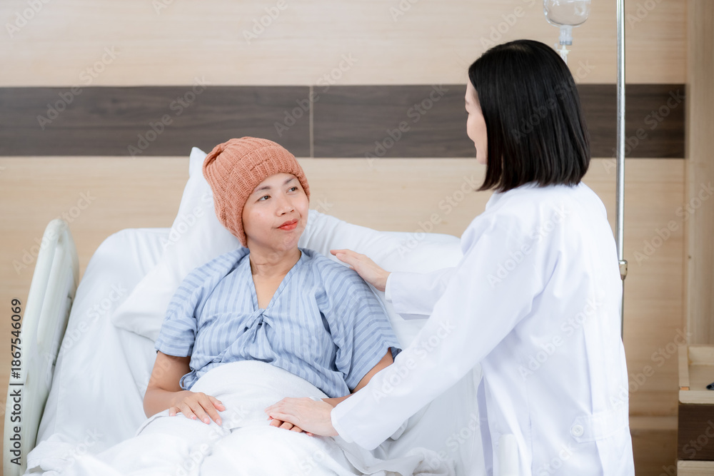 Fototapeta premium The doctor gently places a hand on the patient’s shoulder while speaking with her, creating a warm and reassuring atmosphere.