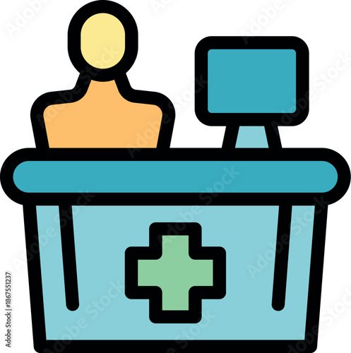 Hospital receptionist working on a computer at the reception desk of a medical clinic