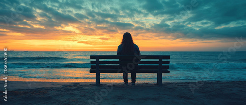 At sunset by the sea, a solitary figure contemplates eternity, emphasising the melancholy of nature — the perfect atmospheric backdrop for philosophical articles or meditative apps.